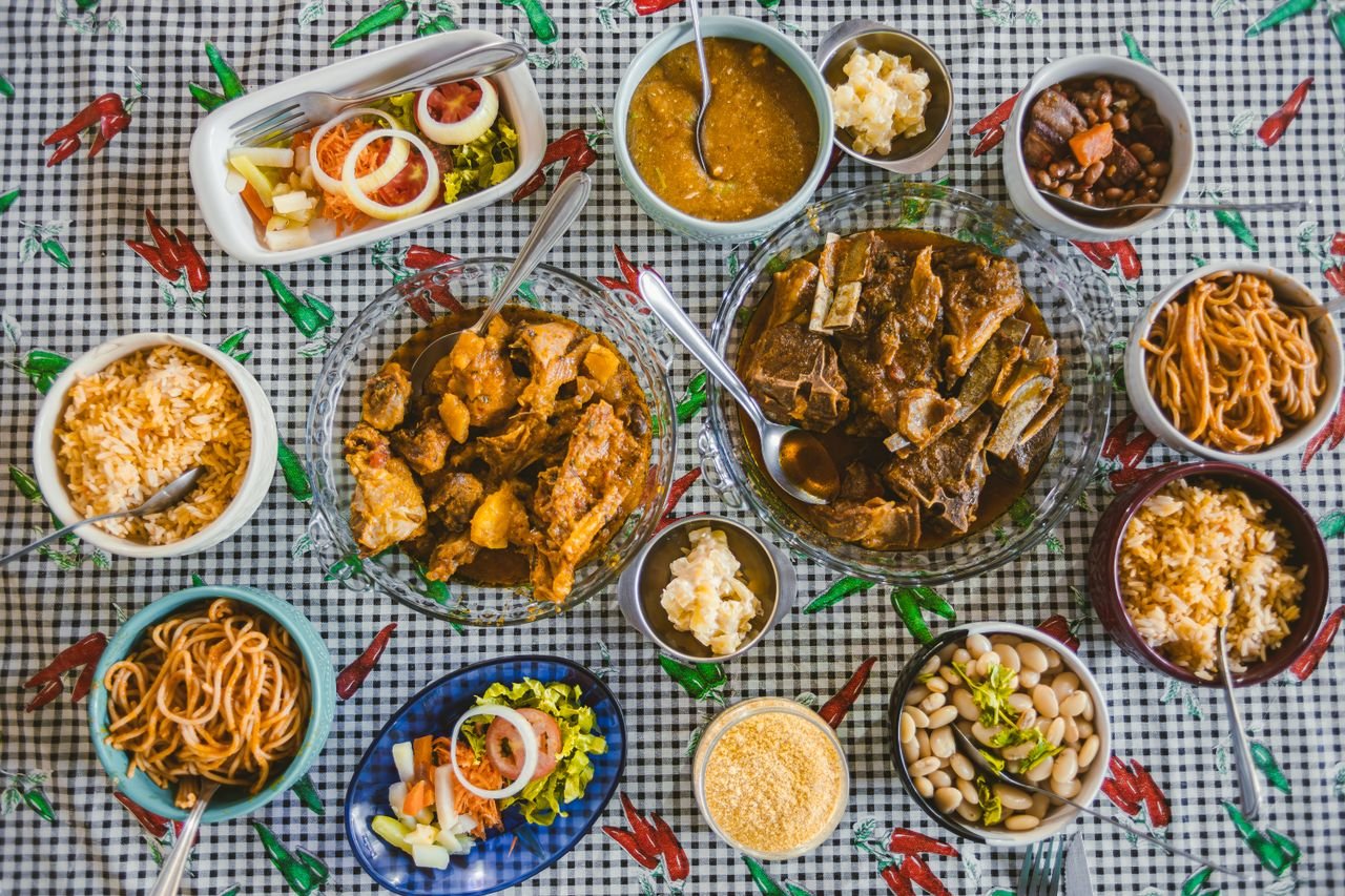 services-01 A diverse Brazilian feast displayed in a traditional setting, showcasing local cuisine varieties.