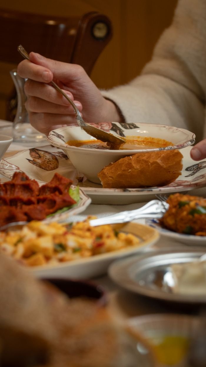 A delightful spread of traditional Turkish dishes at a cozy indoor setting in Gaziantep.