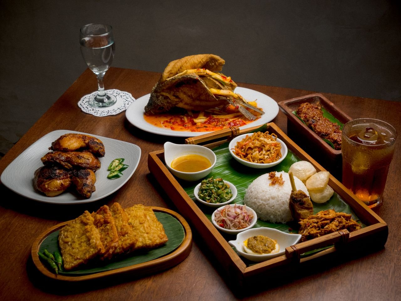 A vibrant spread of traditional Indonesian dishes in Jakarta, showcasing rich culinary traditions.